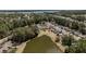 Picturesque aerial view of the neighborhood and pond offering stunning views of the area at 1465 Water Edge Dr, Charleston, SC 29492