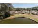 Scenic aerial view of the property with views of the pond, trees, and community amenities at 1465 Water Edge Dr, Charleston, SC 29492