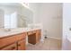 Bathroom features double sinks, vanity, and a large mirror over wood cabinets at 1465 Water Edge Dr, Charleston, SC 29492