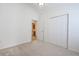 View of a carpeted bedroom with a connecting door that leads to a bathroom at 1465 Water Edge Dr, Charleston, SC 29492