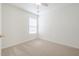 Bright, carpeted bedroom with a ceiling fan and a large window offering natural light at 1465 Water Edge Dr, Charleston, SC 29492