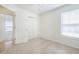 Clean bedroom with carpet flooring, closet doors, and window for natural light at 1465 Water Edge Dr, Charleston, SC 29492