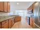 Modern kitchen boasts stainless steel appliances, granite countertops, and wooden cabinets at 1465 Water Edge Dr, Charleston, SC 29492