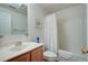 This bathroom features a shower with curtain, toilet, and single sink with vanity at 1530 Fort Johnson Rd # 3C, Charleston, SC 29412