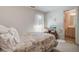 This cozy bedroom leads to the ensuite bathroom and includes a window with natural light at 1530 Fort Johnson Rd # 3C, Charleston, SC 29412