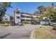 Exterior shot of the complex featuring a parking lot, lush landscaping, multiple levels, and convenient access points at 1530 Fort Johnson Rd # 3C, Charleston, SC 29412