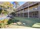 Multi-story building with multiple balconies, surrounded by well-manicured landscaping at 1530 Fort Johnson Rd # 3C, Charleston, SC 29412