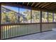 A screened patio offers tranquil views of the green lawn and nearby building at 1530 Fort Johnson Rd # 3C, Charleston, SC 29412