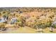 Aerial shot of house and backyard surrounded by trees, with a pier, and view of the marsh at 1540 Strathmore Ln, Mount Pleasant, SC 29464