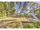 Spacious backyard with a grass lawn, mature trees, and a patio area at 1540 Strathmore Ln, Mount Pleasant, SC 29464