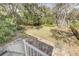 Landscaped backyard featuring a well-maintained lawn, natural stone patio, and staircase at 1540 Strathmore Ln, Mount Pleasant, SC 29464