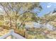 Scenic backyard view overlooking a tranquil pond and lush greenery, creating a peaceful retreat at 1540 Strathmore Ln, Mount Pleasant, SC 29464
