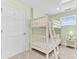 Cozy bedroom showcasing a bunk bed, soft carpet, and bright natural light at 1540 Strathmore Ln, Mount Pleasant, SC 29464