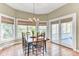 Bright dining room with large windows, a chandelier, and a dining table at 1540 Strathmore Ln, Mount Pleasant, SC 29464