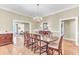 Bright dining room featuring wood floors, a chandelier, and access to other living areas at 1540 Strathmore Ln, Mount Pleasant, SC 29464