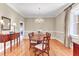 Spacious dining room with hardwood floors, a chandelier, and a large dining table for eight at 1540 Strathmore Ln, Mount Pleasant, SC 29464