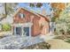 Exterior view of garage of a brick home featuring a two-car garage and well-maintained landscaping at 1540 Strathmore Ln, Mount Pleasant, SC 29464