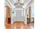 Bright foyer with hardwood floors, decorative ceiling, and a classic front door with sidelights at 1540 Strathmore Ln, Mount Pleasant, SC 29464
