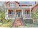 Inviting front porch with brick steps and metal railings leading to the entrance at 1540 Strathmore Ln, Mount Pleasant, SC 29464