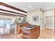 Open kitchen design with wood cabinets, an island cooktop, and seamless flow into the living area at 1540 Strathmore Ln, Mount Pleasant, SC 29464