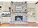 Cozy living room with a brick fireplace, built-in shelves, and a mounted television at 1540 Strathmore Ln, Mount Pleasant, SC 29464