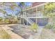 Outdoor patio with stone floor, plants, stairs to screened in porch and fenced yard at 1540 Strathmore Ln, Mount Pleasant, SC 29464