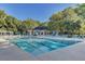 Resort-style pool with ample lounge chairs, umbrellas, and a clubhouse in a lush community setting at 1540 Strathmore Ln, Mount Pleasant, SC 29464