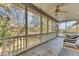 Screened porch with a seating area featuring a ceiling fan and waterfront views at 1540 Strathmore Ln, Mount Pleasant, SC 29464