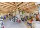 A storage space underneath home with shelves, tools, and lawn equipment in an unfinished room at 1540 Strathmore Ln, Mount Pleasant, SC 29464
