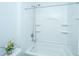 Clean bathroom with modern tub and shower combination, white fixtures, and neutral decor at 157 Sea Lavender Ln, Summerville, SC 29486
