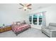 Bright bedroom with a ceiling fan and view of outdoor patio at 157 Sea Lavender Ln, Summerville, SC 29486
