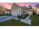 Charming home exterior featuring a two-car garage and manicured landscaping at 157 Sea Lavender Ln, Summerville, SC 29486