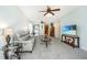 Inviting living room featuring neutral decor, a comfortable sofa, and modern entertainment setup at 157 Sea Lavender Ln, Summerville, SC 29486