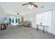 Bright living room with large windows, stylish furniture, and an open concept design, great for entertaining at 157 Sea Lavender Ln, Summerville, SC 29486