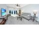 Well-lit living room with a large TV, a comfortable sofa, and a view to the outdoor patio at 157 Sea Lavender Ln, Summerville, SC 29486