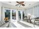 Relaxing sunroom featuring tile floors, natural light and wicker furniture at 157 Sea Lavender Ln, Summerville, SC 29486