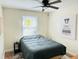 Cozy bedroom features a ceiling fan, natural light, and stylish decor for comfortable living at 1610 Larry St, North Charleston, SC 29406