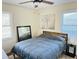 Comfortable bedroom with natural light from two windows and simple decor for a relaxing space at 1610 Larry St, North Charleston, SC 29406