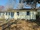 Inviting single-story home with a blue front door and tidy landscaping at 1610 Larry St, North Charleston, SC 29406