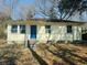 Charming single-story home featuring a bright blue door and classic curb appeal at 1610 Larry St, North Charleston, SC 29406