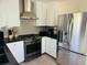 Modern kitchen with stainless steel appliances, sleek countertops, and ample cabinet space at 1610 Larry St, North Charleston, SC 29406