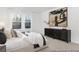 Cozy bedroom featuring a comfortable bed, dresser, and soft lighting at 169 Surf Bird St # 514P, Summerville, SC 29486
