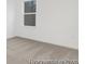Bright bedroom featuring a large window and plush carpeting at 169 Surf Bird St # 514P, Summerville, SC 29486