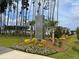 Beautiful entrance to North Creek Village with landscaping and signage at 169 Surf Bird St # 514P, Summerville, SC 29486