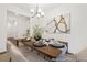 Open dining room with modern decor, an elegant chandelier, and an eye-catching art piece that complements the space at 169 Surf Bird St # 514P, Summerville, SC 29486