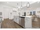 Well-designed kitchen with an island with bar seating, stainless steel appliances and open to the adjacent living room at 169 Surf Bird St # 514P, Summerville, SC 29486