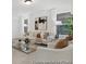 Well-lit living room with a comfortable sofa, accent chairs, and a modern coffee table at 169 Surf Bird St # 514P, Summerville, SC 29486