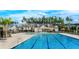 A beautiful community pool with lounge chairs, umbrellas, and clubhouse, offering a resort-style amenity at 169 Surf Bird St # 514P, Summerville, SC 29486
