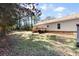 Expansive backyard featuring the home, a wooden deck, and green lawn at 1816 Grimball Rd, Charleston, SC 29412