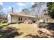 Exterior view showcasing the home, a deck, lawn, and a storage shed at 1816 Grimball Rd, Charleston, SC 29412